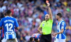 Antonio Mateu Lahoz showing a red card with the yellow in his other hand