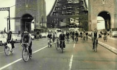 Cyclists ride across Sydney’s Harbour Bridge, holding up car traffic, in 1974