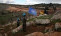 File image of UN peacekeepers holding their flag near the southern Lebanese-Israeli border