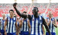 Majak Daw reacts as he leads Kangaroos players from the field following the AFL match between North Melbourne and Adelaide