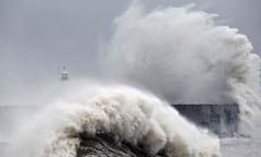 Water sprays as waves crash over Newhaven lighthouse