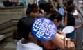 a person holds a sign that reads 'keep abortion legal'