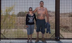 Veronica and Vito against the fence.