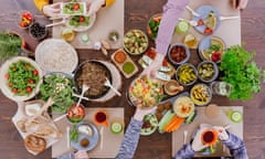 Friends having vegetarian feast, sitting at rustic table<br>MP8208 Friends having vegetarian feast, sitting at rustic table