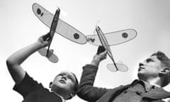 Boys and their toy airplanes, France, circa 1940. 