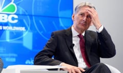 It’s a headache: Philip Hammond on a panel session at the World Economic Forum in Davos.