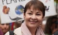 Caroline Lucas pictured in front of demonstrators with banners on the Restore Nature Now march in London