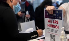 Job seeker next to 'we are hiring' sign