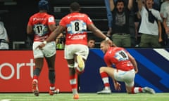 Finn Russell turns to celebrate with his Racing 92 teammates after scoring a remarkable individual try in the Champions Cup quarter-final against Sale