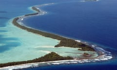 FILES-TUVALU-AUSTRALIA-CLIMATE-SECURITY<br>(FILES) The South Pacific pounds the serpentine coastline of Funafuti Atoll on February 19, 2004. Citizens of climate-threatened Tuvalu will have the right to live in Australia under a landmark pact unveiled on November 10, 2023 -- an offer of refuge as their Pacific homeland is lost beneath the seas. (Photo by TORSTEN BLACKWOOD / AFP) (Photo by TORSTEN BLACKWOOD/AFP via Getty Images)