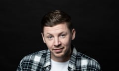 Professor Green smiling.