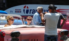 Tourists from the US pose in an old American car in Havana.