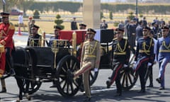 Egyptian honour guards escort the coffin of former president Hosni Mubarak during his funeral in Cairo.