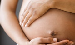 Close up of pregnant woman's belly