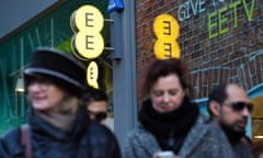 People outside an EE shop