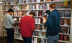 men browse stand reading books