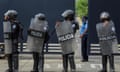 Riot police stand guard outside ‘El Chipote’, where Georgiana Aguirre-Sacasa believes her father is being detained. 