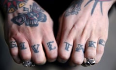 A tattoo enthusiast poses at the International London Tattoo Convention in London