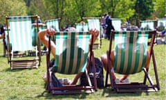 Two people sitting on deckchairs