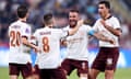 Rodri (right) celebrates a Manchester City goal with his teammates