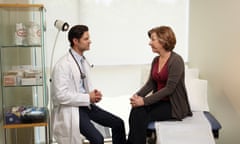 Male Doctor Consults with Female Patient<br>GettyImages-125116063