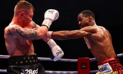 Carl Frampton tries to defend against Jamel Herring