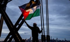 a person carries a Palestinian flag