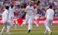 England's Chris Woakes celebrates with teammates after taking the wicket of West Indies' Kraigg Brathwaite.