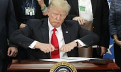 Donald Trump prepares to sign an executive order to build a border wall