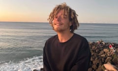 Jackson Stacker in front of a beach sunset