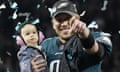 Nick Foles holds his daughter, Lily James, after winning the Super Bowl