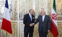 French foreign minister Laurent Fabius shakes hands with Mohammad Javad Zarif,  his Iranian counterpart, during a visit to Iran in July.