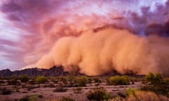 A dust storm at sunset in the Arizona desert. Photograph: mdesigner125/Getty Images/iStockphoto