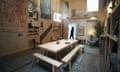 A visitor looks through A Showroom for Granby Workshop by Assemble at the Tramway art space in Glasgow