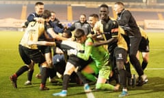 Marine players celebrate their victory on penalties against Colchester in the first round of the FA Cup on Saturday.