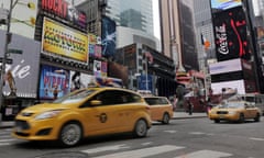 FILE - This Feb. 27, 2014 file photo shows New York City taxis passing through New York’s Times Square. A New York man who talked about wanting to throw a grenade in Times Square has been arrested and is expected to be arraigned Friday on weapons-related charges, law enforcement officials told The Associated Press. (AP Photo/Richard Drew, File)