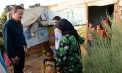 David Cameron meets Syrian refugee families at a tented settlement camp in the Bekaa Valley on the Syrian–Lebanese border.