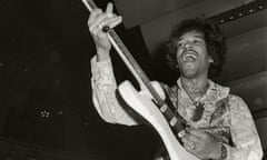 Jimi Hendrix performing on stage.