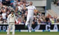 England's Mark Wood celebrates after taking the wicket of Australia's Usman Khawaja