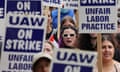 Person wearing sunglasses surrounded by strike signs