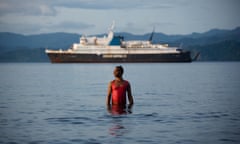 Monica takes a dip in the sea exactly as the ferry passes behind her on its way to Suva