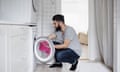 man at washing machine