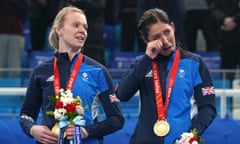 Team GB curling captain Eve Muirhead wipes away the tears atop the podium with Vicky Wright. 