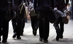 legs of children in school uniforms