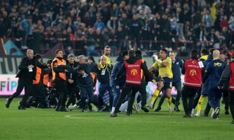 Trabzonspor fans storm pitch and attack Fenerbahce players in latest ugly Super Lig scenes – video