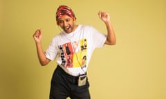 Rhik dancing with headphones on in front of a yellow background