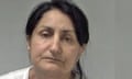 Narinder Kaur, 54: police mugshot showing a woman with long, straight dark hair tied back from her face. She wears no make-up or visible jewellery and is frowning.