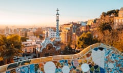 Barcelona at sunrise viewed from park Guell, Barcelona, Catalonia, Spain.<br>View of the city from Park Guell in Barcelona, Spain with sunrise colors.