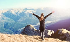 Woman on top of a mountain