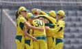 Australia players mob Tayla Vlaeminck after she takes the wicket of Bangladesh’s Sobhana Mostary